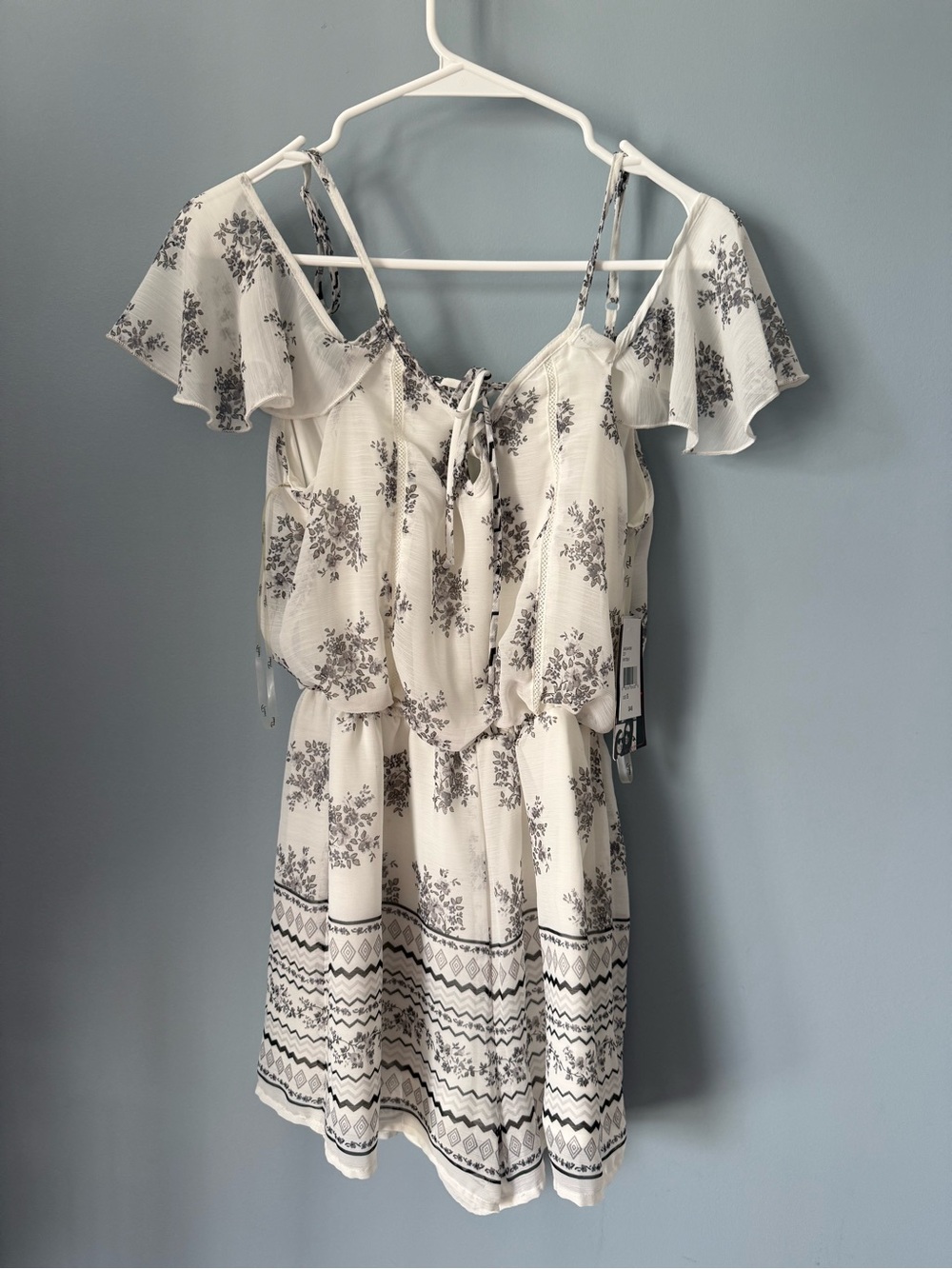 Trixxi Cream Romper with Gray Floral Print and Flutter Sleeves